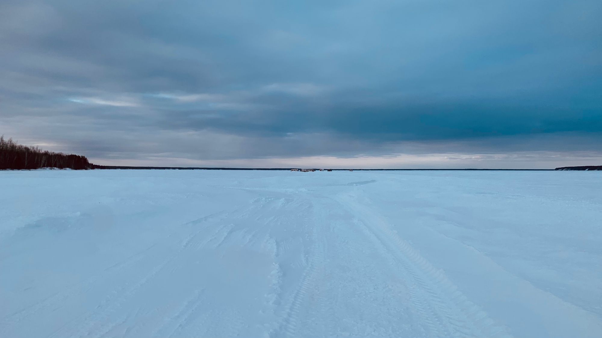 I ventured out onto the lake to look at the ice fishing shacks. They were huddled together in little communities, connected and divided by where the roads had been plowed.